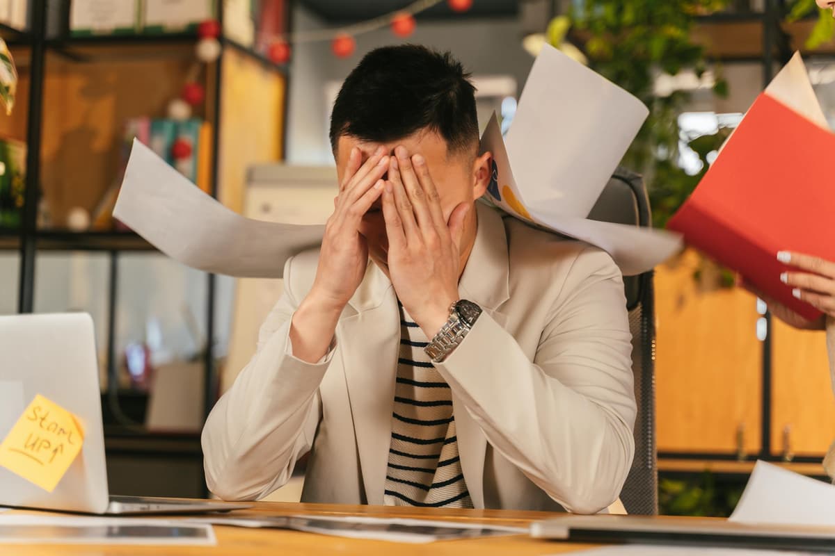 Business owner overwhelmed by loan paperwork