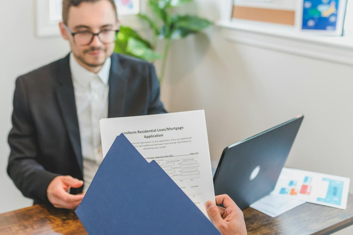 Advisor reviewing SBA loan application with client